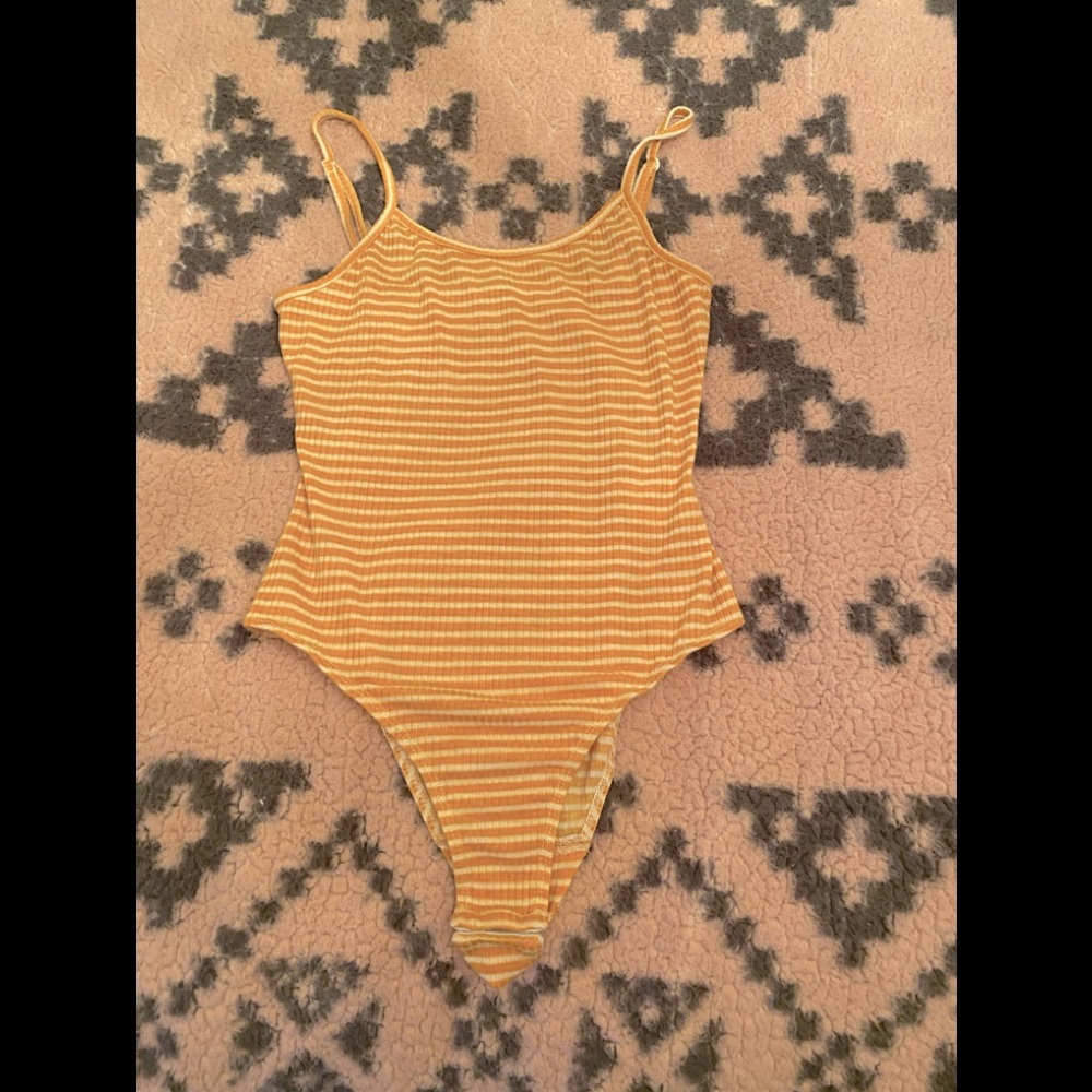 Yellow and white body suit